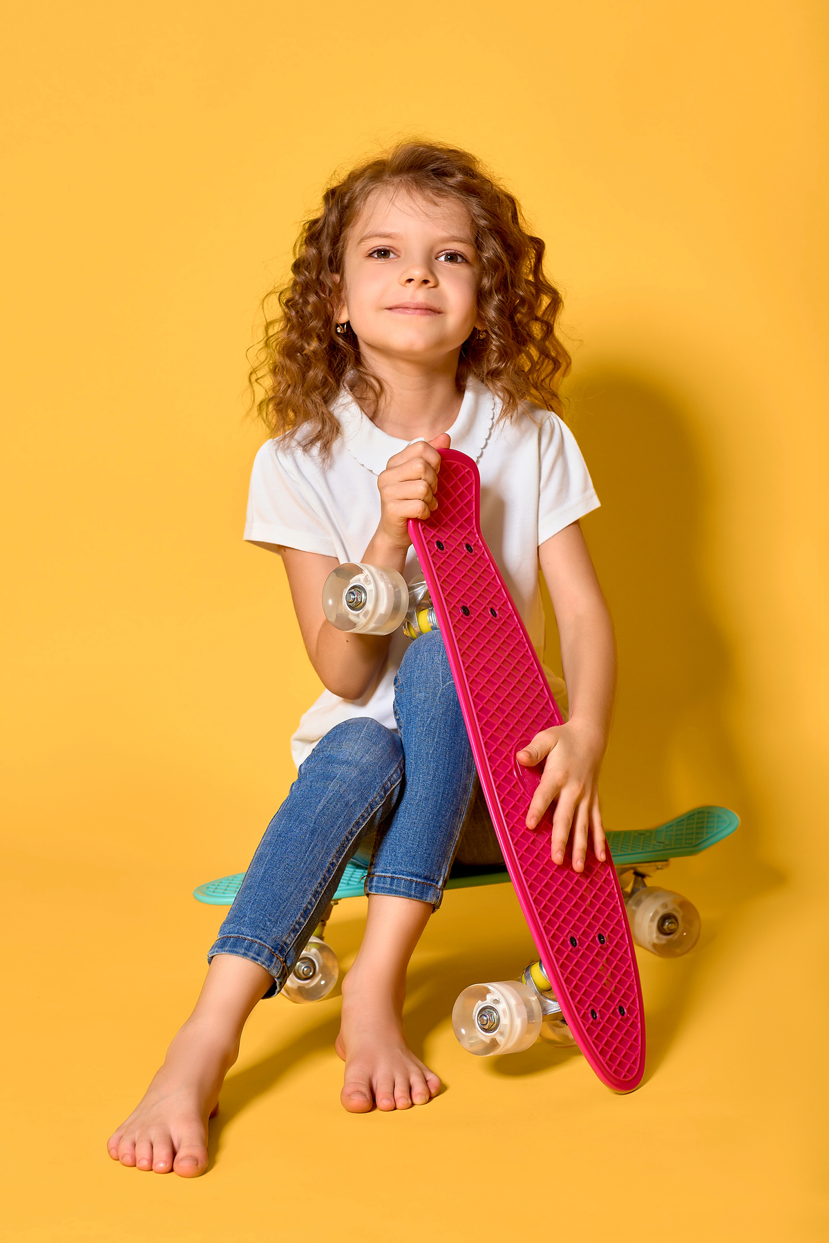 Child with Curly Hair with Skateboard  